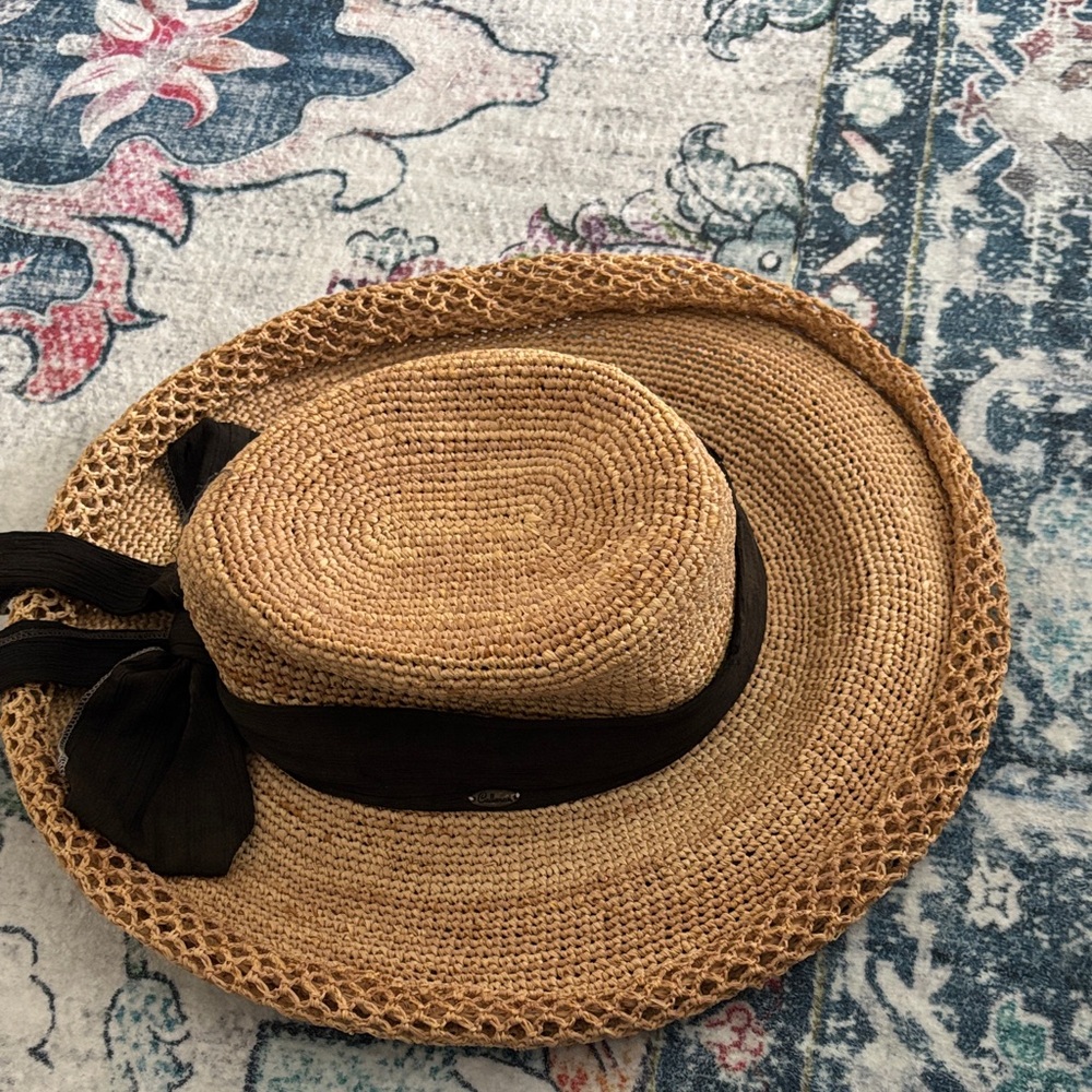 Elegant Tan Straw Hat with Black Ribbon